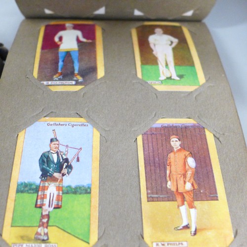 2306 - A large collection of cigarette and tea cards, loose and in albums, including Will's cricketers 1928... 