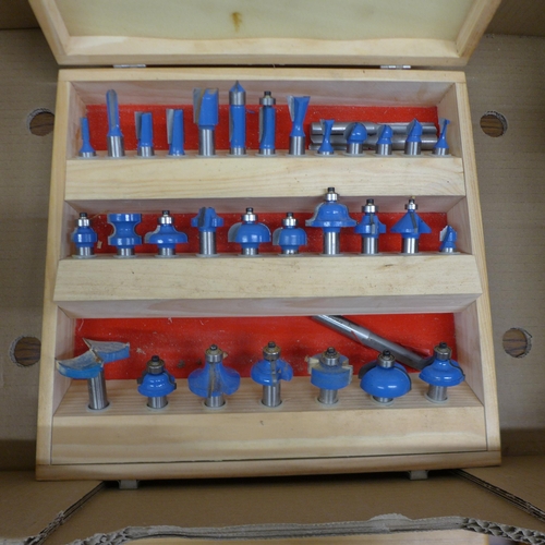 5058 - A large quantity of wooden cased router bit sets including Axminster, Trend and Dewalt, etc.