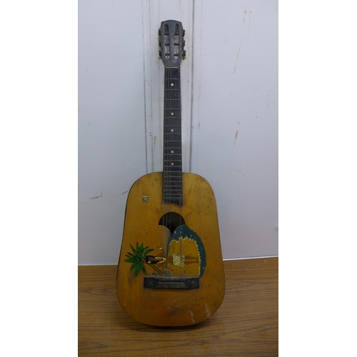 5064 - A vintage Hawaiian style acoustic guitar, an Encore electro acoustic guitar and an Aria Pro II elect... 