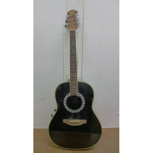 5064 - A vintage Hawaiian style acoustic guitar, an Encore electro acoustic guitar and an Aria Pro II elect... 