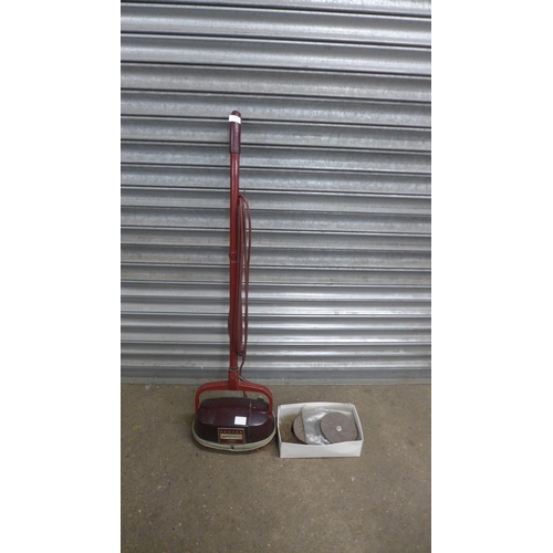 5106 - A vintage Hoover floor polisher with a quantity of spare pads and brushes