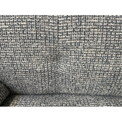 3135 - A white and blue woven two seater sofa