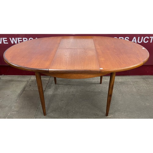 86 - A G-Plan Fresco teak circular extending dining table