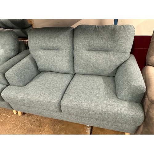 3180 - A dark cyan upholstered three seater sofa, two seater sofa, armchair and footstool