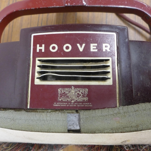 5106 - A vintage Hoover floor polisher with a quantity of spare pads and brushes