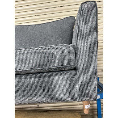 3204 - A grey woven upholstered three seater sofa