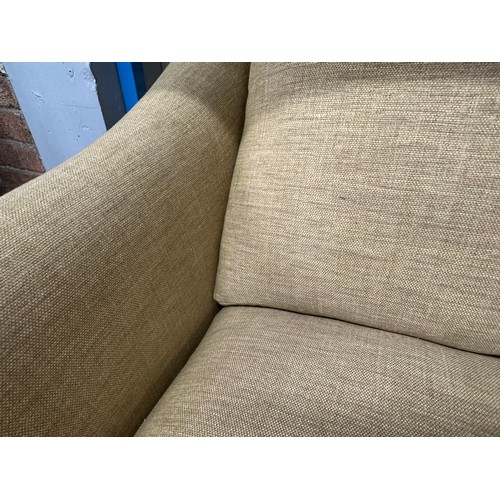 3205 - A turmeric upholstered deep seating three seater sofa