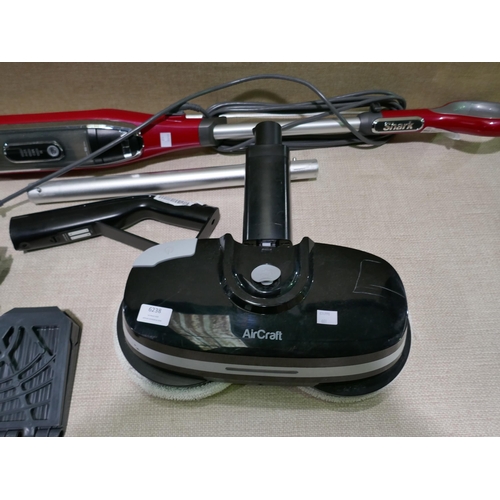 6238 - Powerglide floor cleaner and a shark steam mop (missing battery) (353-661) *This lot is subject to V... 