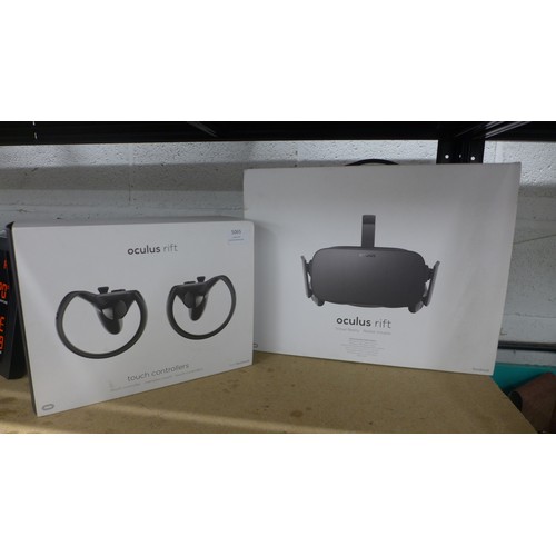 5065 - An Oculus Rift VR gaming headset and sensors with touch controllers, both boxed