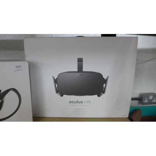 5065 - An Oculus Rift VR gaming headset and sensors with touch controllers, both boxed