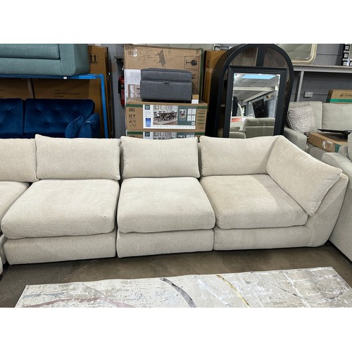 3208 - A sand upholstered six piece sectional corner sofa