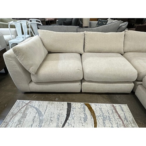 3208 - A sand upholstered six piece sectional corner sofa