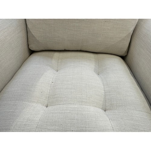 3215 - An ivory upholstered deep seating armchair with exposed wood