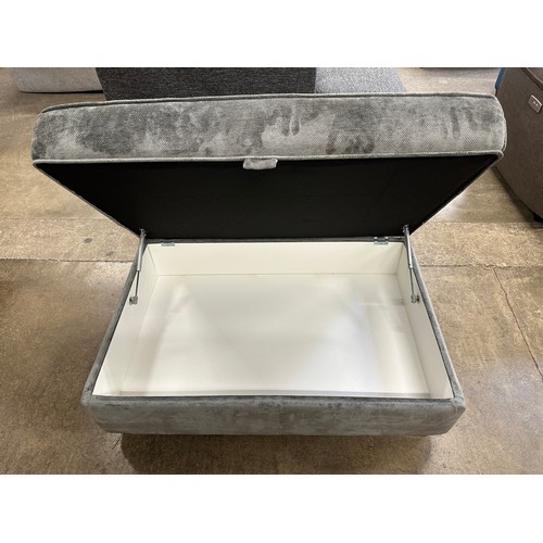 3217 - A large grey upholstered storage footstool (damaged)