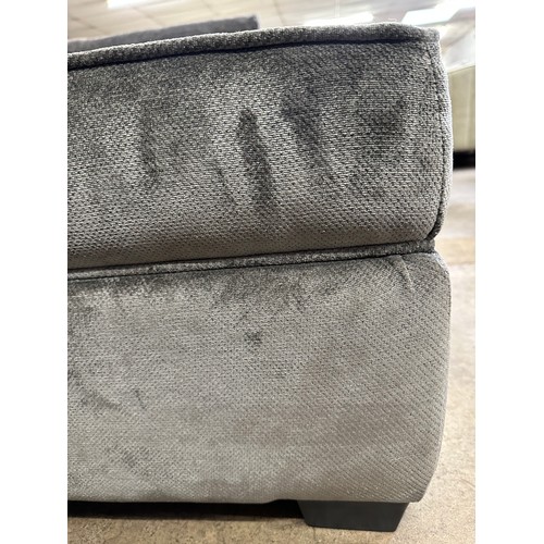 3217 - A large grey upholstered storage footstool (damaged)