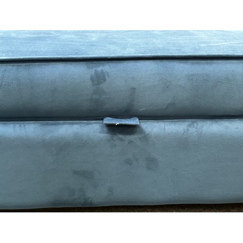 3219 - A large dark blue velvet storage footstool (damaged)