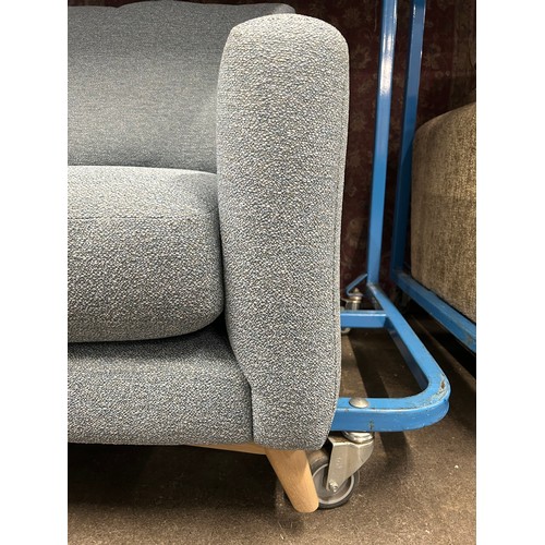 3255 - A light blue boucle upholstered two seater sofa