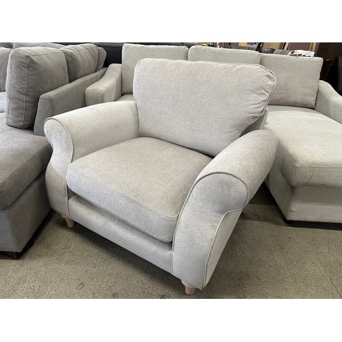 3296 - A light grey upholstered armchair