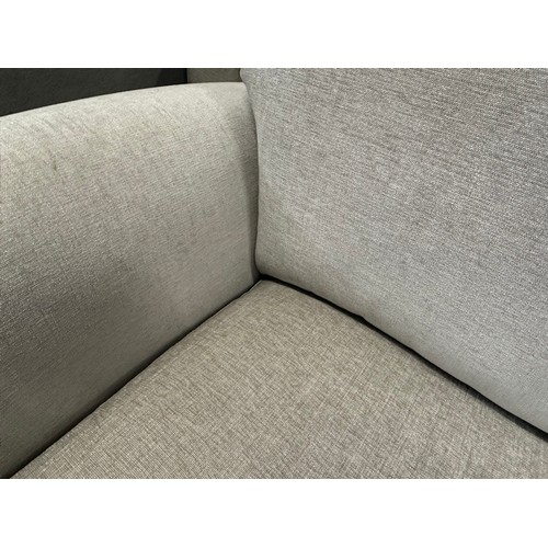 3296 - A light grey upholstered armchair