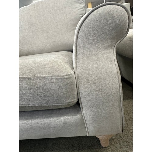 3296 - A light grey upholstered armchair