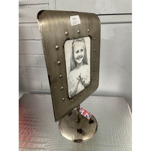 3100 - A large metal photo frame