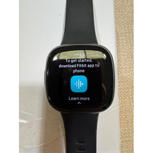 6008 - Fitbit Versa 4 fitness smart watch with black activity band *This lot is subject VAT