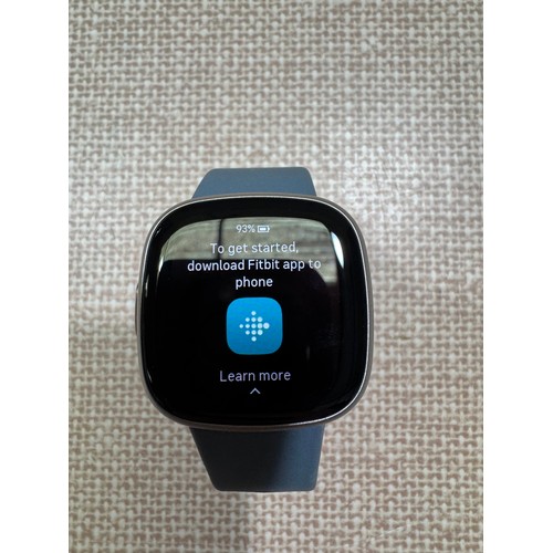 6009 - Fitbit Versa 4 fitness smartwatch with blue infinity band, model no: FB523 *This lot is subject to V... 