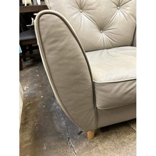 3202 - A stone synthetic leather armchair