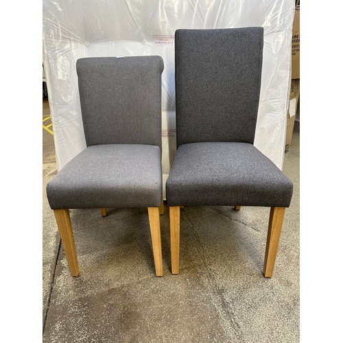 3260 - A pair of mixed grey dining chairs with wooden legs *This lot is subject to VAT