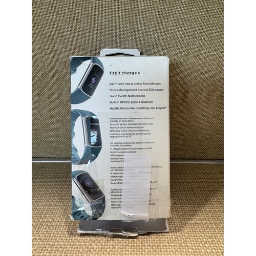 6029 - Fitbit Charge 5 fitness tracker with blue activity band *This lot is subject to VAT