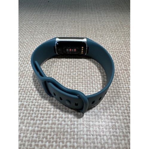 6029 - Fitbit Charge 5 fitness tracker with blue activity band *This lot is subject to VAT