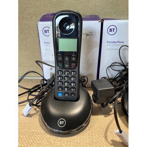 6043 - Two BT Everyday cordless home phones - one missing battery cover *This lot is subject to VAT