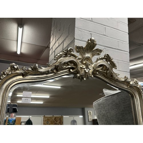 3078 - A large silver carved framed mirror