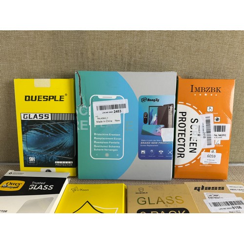 6059 - A quantity of various glass screen protectors and two pop sockets *This lot is subject to VAT