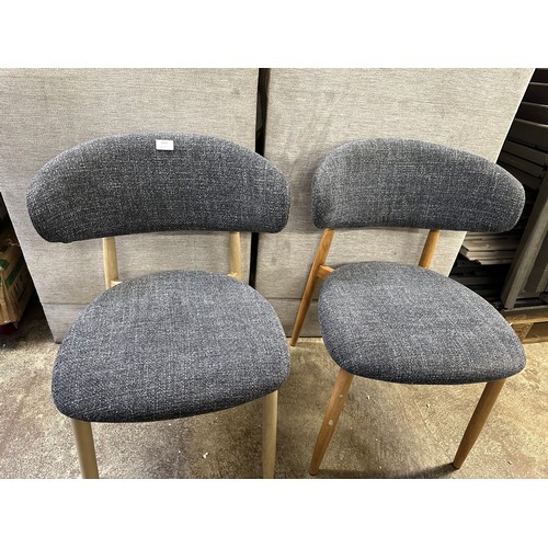 3268 - A pair of Amiri low back chairs *This lot is subject to VAT