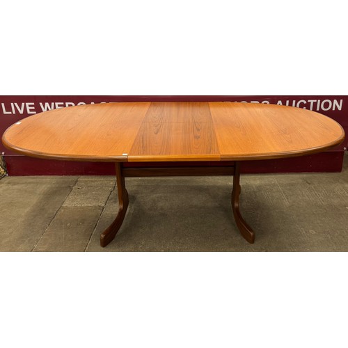 15 - A G-Plan Fresco teak oval extending dining table and six chairs