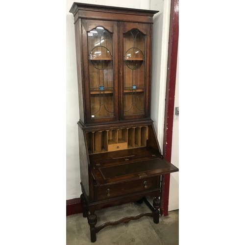 102 - An Arts and Crafts oak bureau bookcase