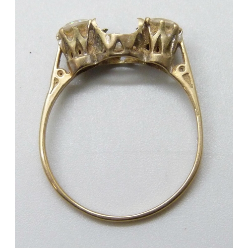 7002 - A 9ct gold ring, lacking one stone, 1.8g, S