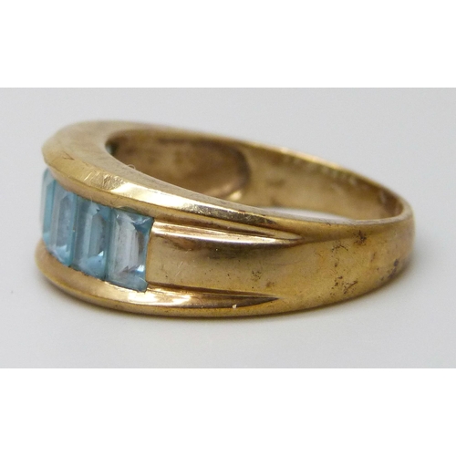 7003 - A 9ct gold ring set with topaz, 5.8g, T