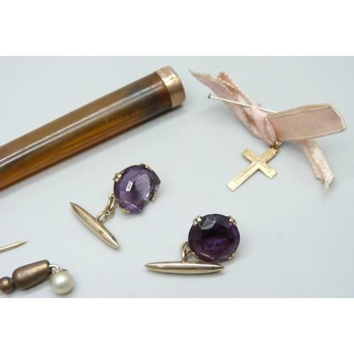 7006 - A pair of nephrite cufflinks, a pair of yellow metal and amethyst cufflinks, a small 18k gold cross ... 