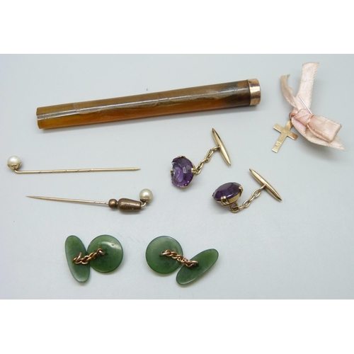 7006 - A pair of nephrite cufflinks, a pair of yellow metal and amethyst cufflinks, a small 18k gold cross ... 