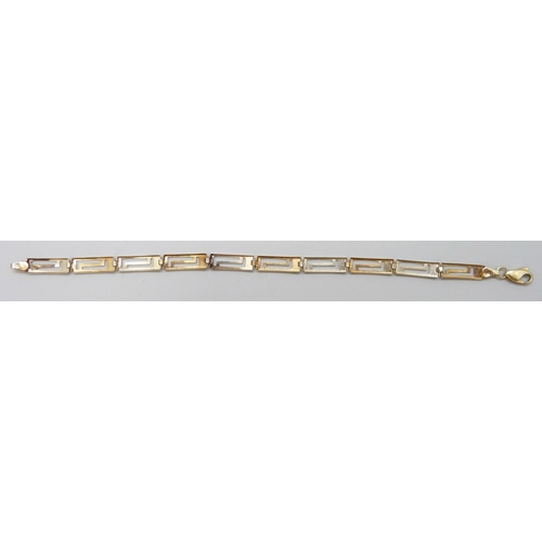 7031 - A 9ct gold two tone Greek key design bracelet, 18.3cm, 3.2g