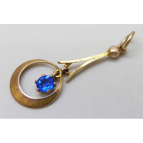 7036 - A 9ct gold pendant set with a blue paste stone, 0.6g, 2.8cm including bale