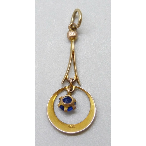 7036 - A 9ct gold pendant set with a blue paste stone, 0.6g, 2.8cm including bale