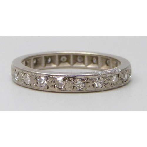 7044 - A white metal set diamond eternity ring, 3.3g, L