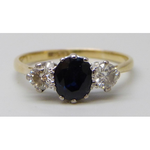 7047 - An 18ct gold, sapphire and diamond three stone ring, 2.7g, Q