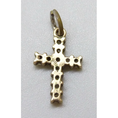 7052 - A small 9k gold cross pendant set with white stones, replacement metal bale, 0.6g total weight, 1.3c... 