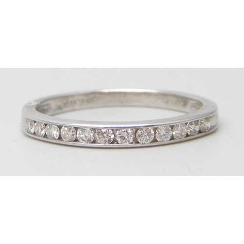 7058 - An 18ct white gold and diamond half eternity ring, 2.4g, O