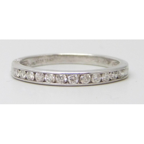 7058 - An 18ct white gold and diamond half eternity ring, 2.4g, O