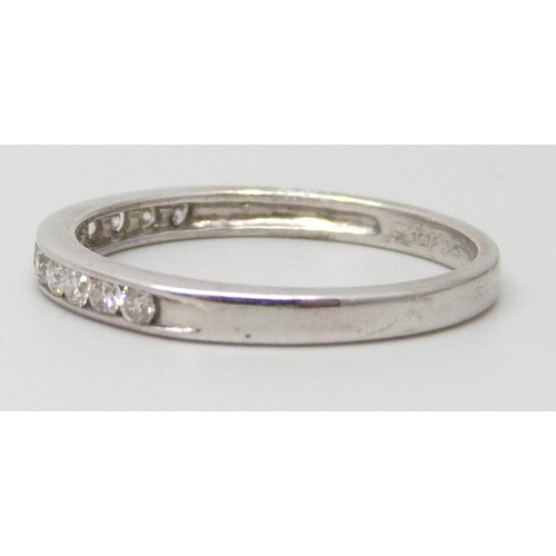 7058 - An 18ct white gold and diamond half eternity ring, 2.4g, O